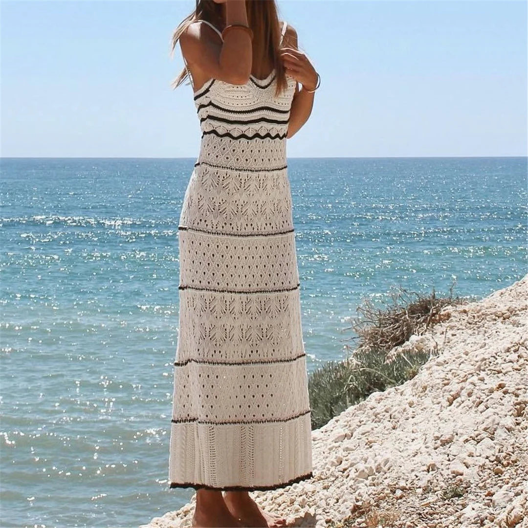 Splicing backless crochet tunic in white for women, expertly knitted as a beach cover-up. Features a playful hollow-out design. Made from Nylon, Polyester, and Cotton. This solid pattern tunic fits true to size. Available in sizes S, M, and L. Free shipping provided on this perfect companion for seaside adventures. Ideal for women aged 18 to 35.
