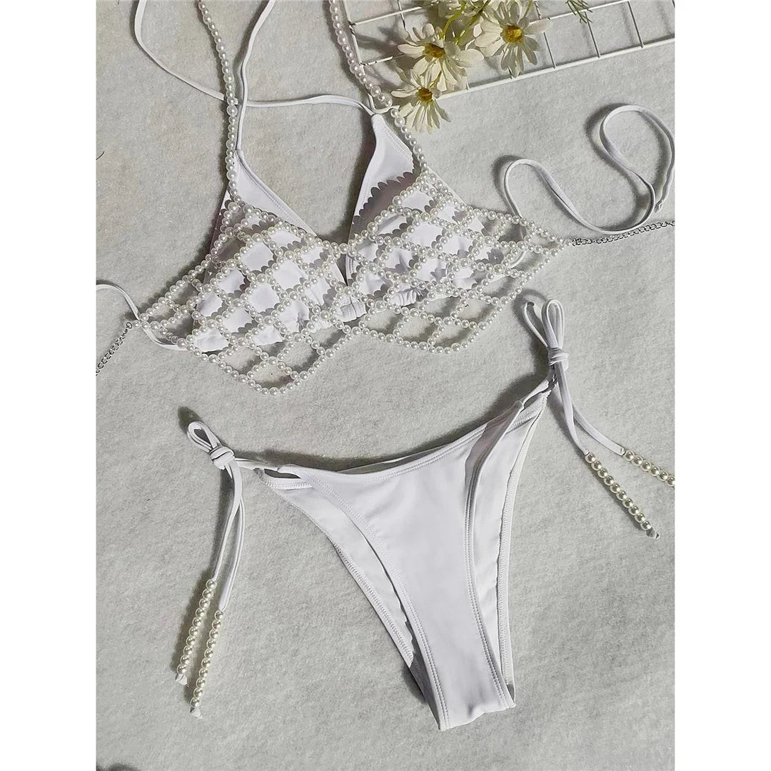 Luxurious Halter Bikini with Pearls and Chains Three-Piece Swimsuit Set in White, Features Strappy Design and Low Waist for a Flattering Silhouette, Made from Comfortable Nylon and Spandex, Suitable for Women, Comes with Pad and Fits True to Size, Available in Sizes S to L