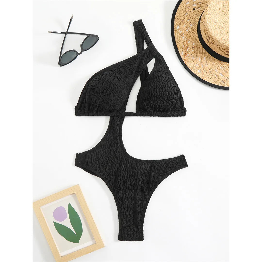 Asymmetric One Shoulder Crinkled Swimsuit with a modern design, crinkled texture, solid monochrome, polyester and spandex blend, adjustable strap for a chic fit.