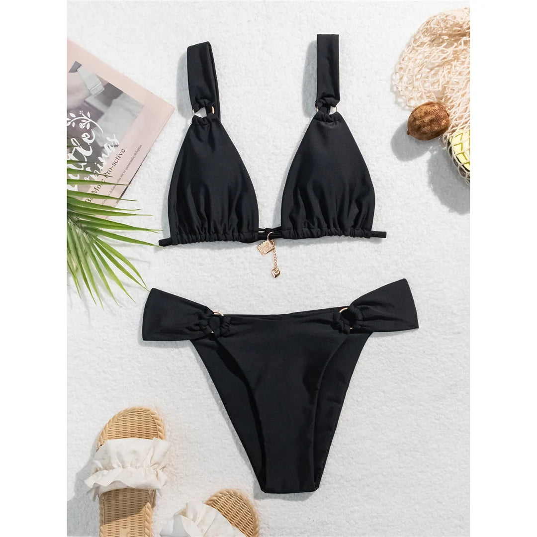 High-leg cut bikini set with stylish metal ring details and padded design for a chic and modern swimwear look for women.