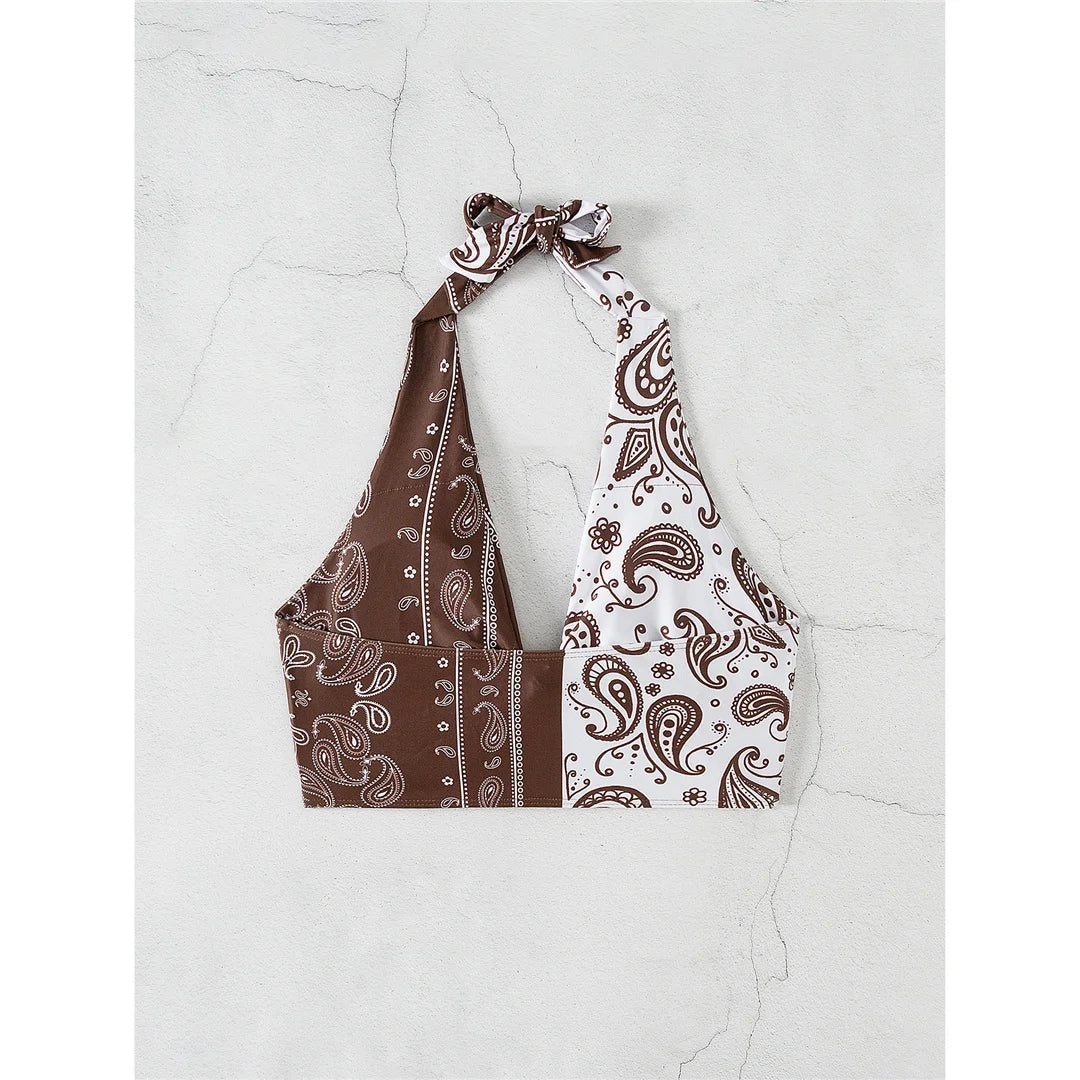 Printed splicing halter knotted bikini top with unique print combination in brown and white, made from polyester and spandex.