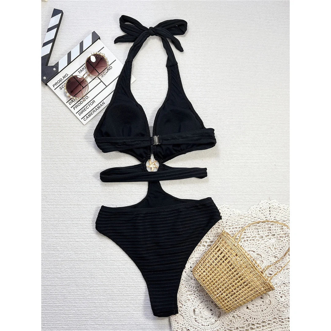 V neck cut-out halter ribbed monokini in solid black with high cut design and adjustable straps for an elegant and confident beach look.