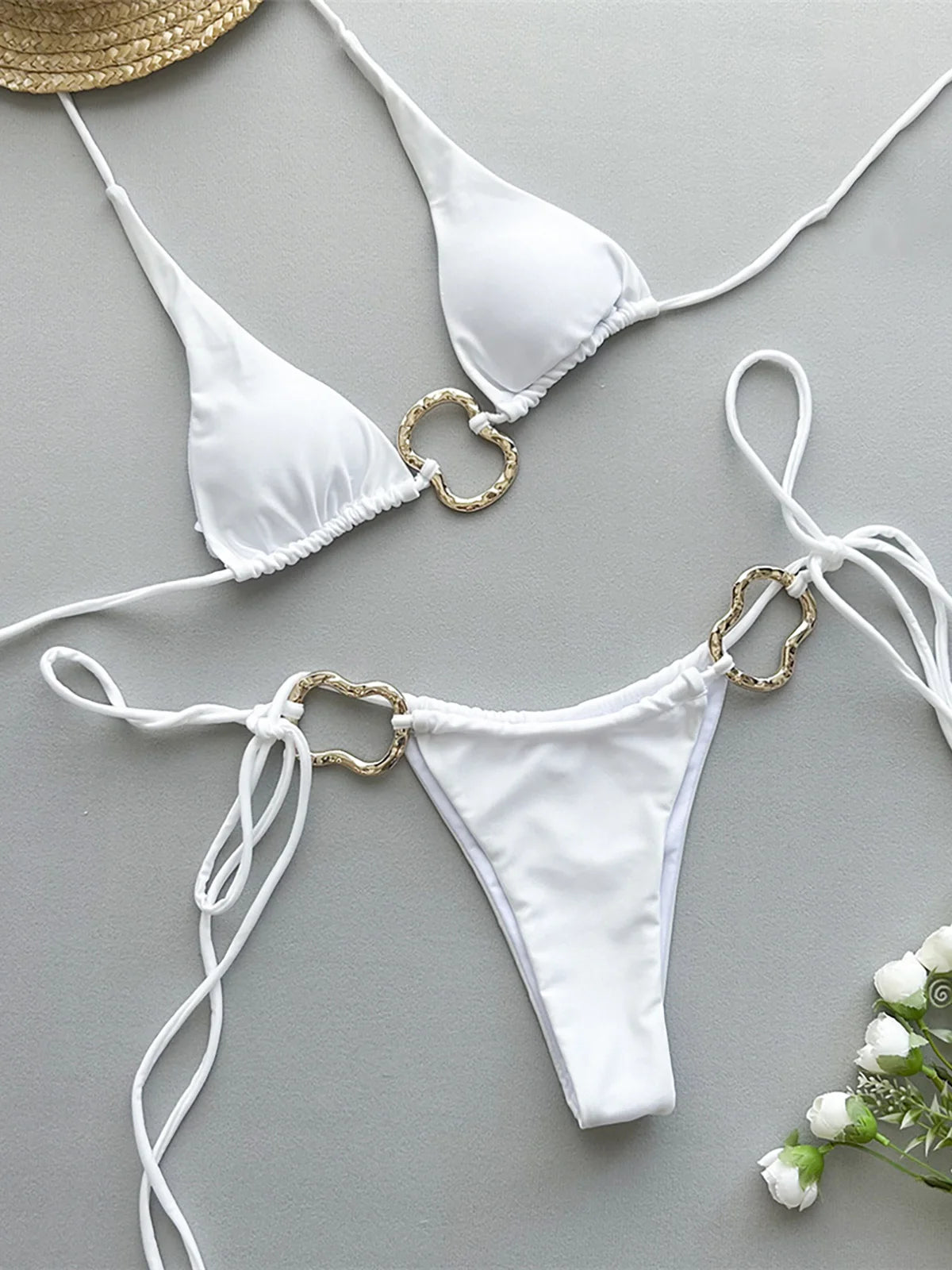 Metal Rings Halter Strappy High Cut Bikini set with chic metal ring accents, Polyester Spandex material, solid pattern, wire-free, low waist design, enhances silhouette for elegance and fashion.