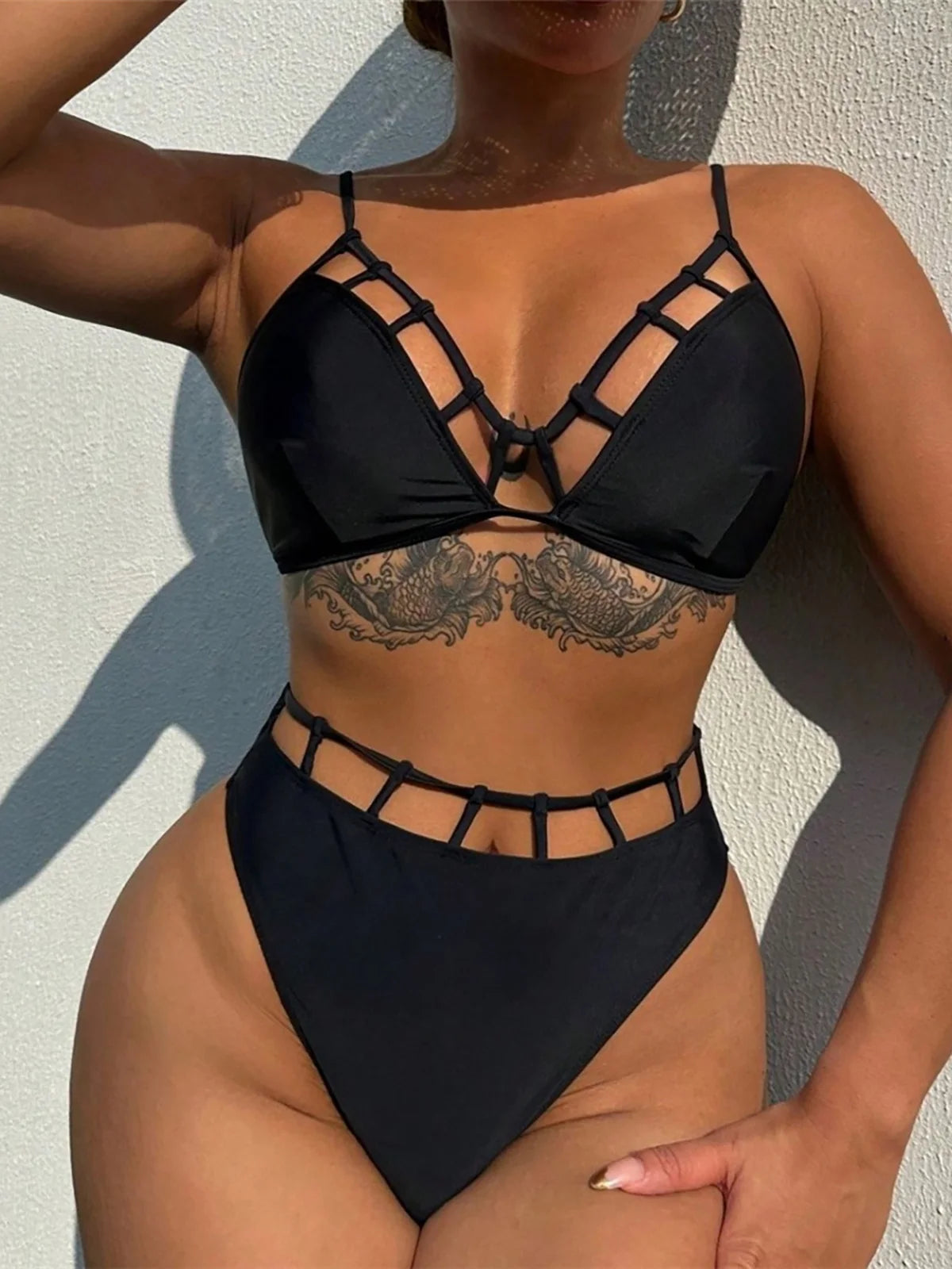 Sophisticated Two-Piece Swimsuit for Women, Features Bold Cut-Out Design and High-Waist Bikini Bottoms, High-Leg Cut, Fits True to Size, Available in Sizes S to XL, Material: Nylon and Spandex, Solid Pattern, Wire Free, Ideal for a Blend of Contemporary Fashion and Classic Comfort, Black Color, Comes with Padding
