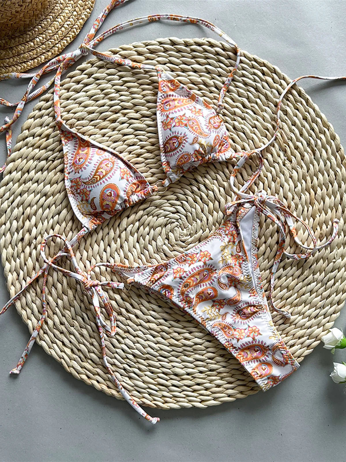 Printed tie-dye halter scrunch butt bikini set, eye-catching design, polyester spandex blend, wire-free support, low waist, women's two-piece swimwear, fun and dynamic look.