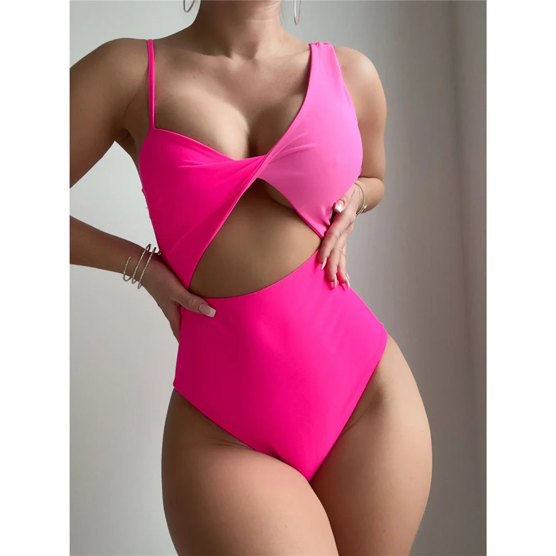 New Asymmetric Cut Out One Piece Swimsuit in Dark Pink, Modern Monokini Design with High Leg Cut and Padding, Made from Nylon and Spandex. Fits True to Size, Sizes Available: S, M, L. Fashion Forward Swimwear for Women.