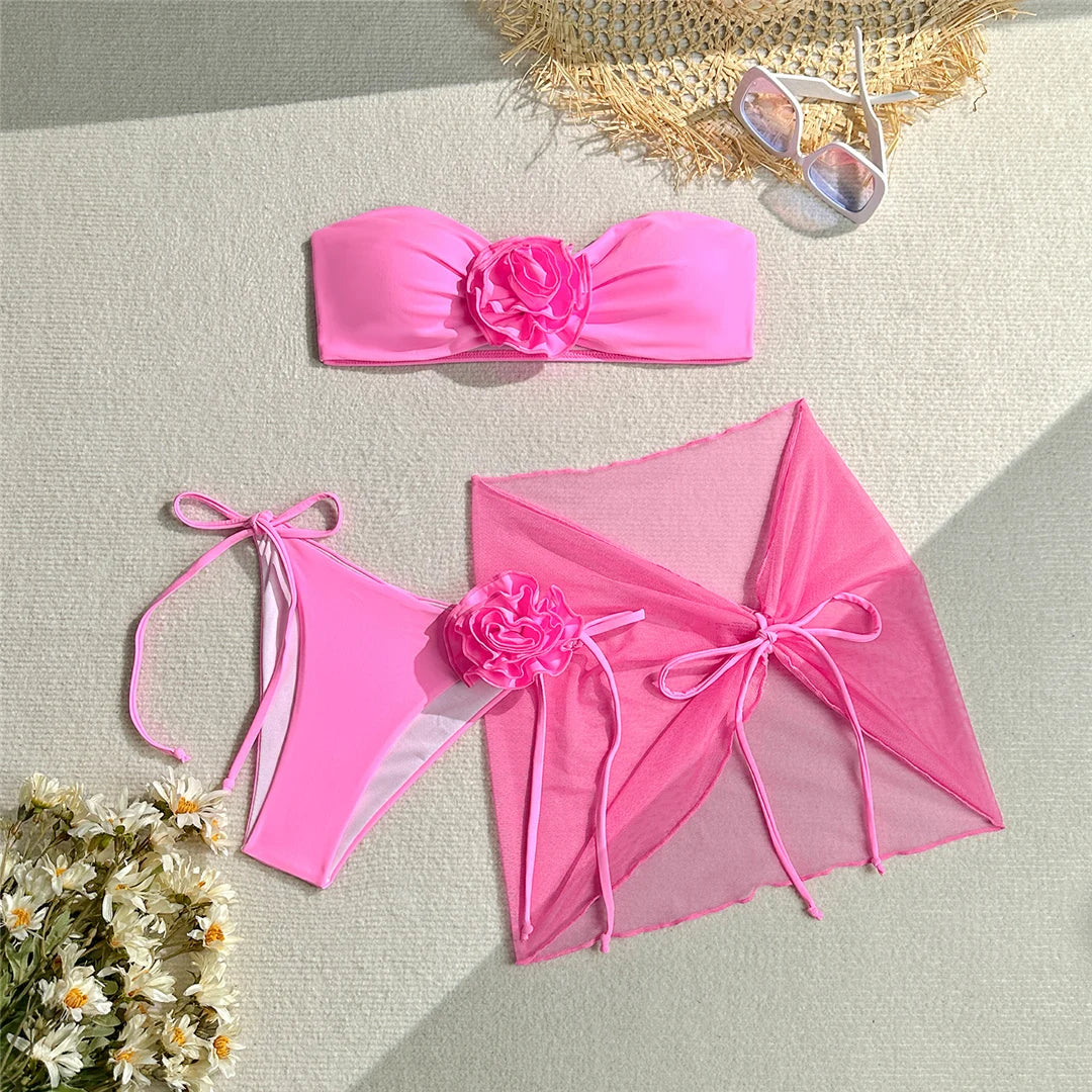 Elegant 3D Flowers Bandeau Bikini with Sarong, Three Piece Women's Swimwear in Pink, Purple, and Blue, Made from Soft Nylon and Spandex, Wire Free Support with Padding, Features Low Waist Bottoms and Fits True to Size. Sizes Available: S, M, L.