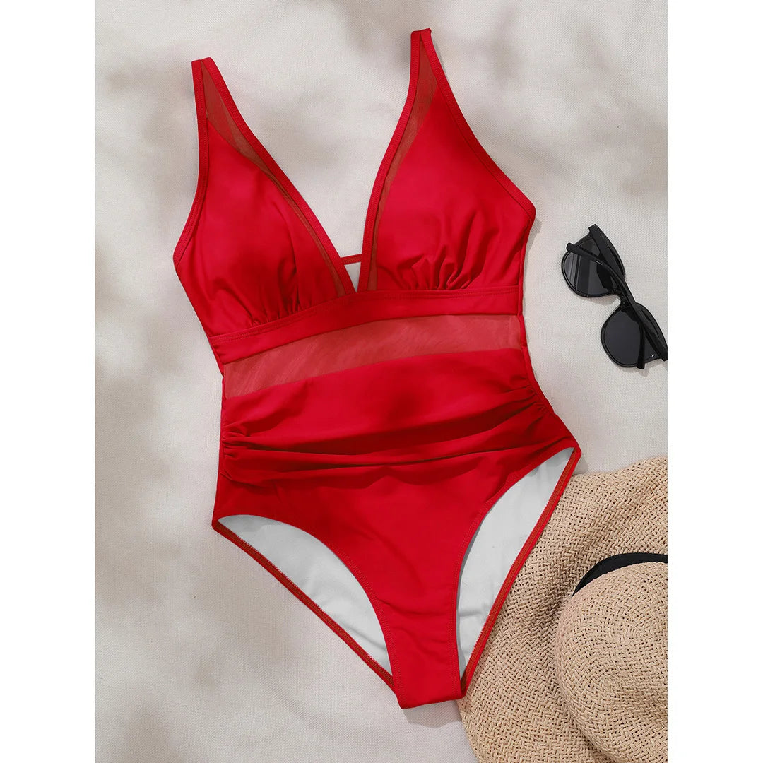 Mesh Sheer V Neck Leopard Printed One Piece Swimsuit erhältlich in den Größen S bis XL. Dieser einteilige Badeanzug oder Monokini aus Nylon und Elasthan ist mit durchsichtigen Mesh-Details und einem auffälligen Leopardenprint versehen. Mit seinem tiefen V-Ausschnitt und der schmeichelhaften Silhouette ist er perfekt, um am Pool oder am Strand einen auffälligen Eindruck zu hinterlassen. Erhältlich in Schwarz, Tiefblau, Pink, Rot, Weiß, Dunkelgrün, Grün, Blätter, Leopard und Multicolor.