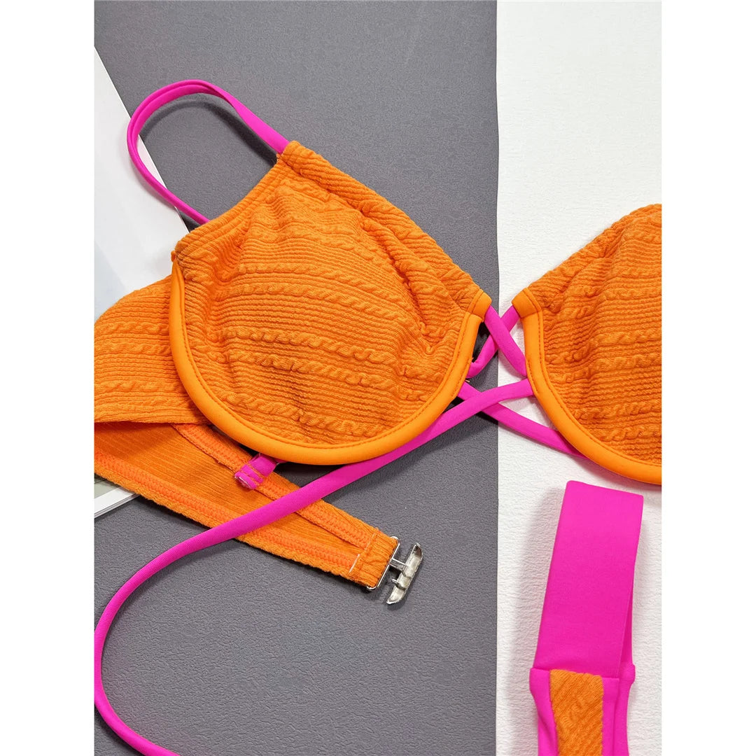 Elegant spliced underwired Brazilian bikini set with patchwork pattern, offering low waist fit and exceptional support, crafted from polyester and spandex for women. Available in colors: Orange Red, Orange, Red, Multicolor.