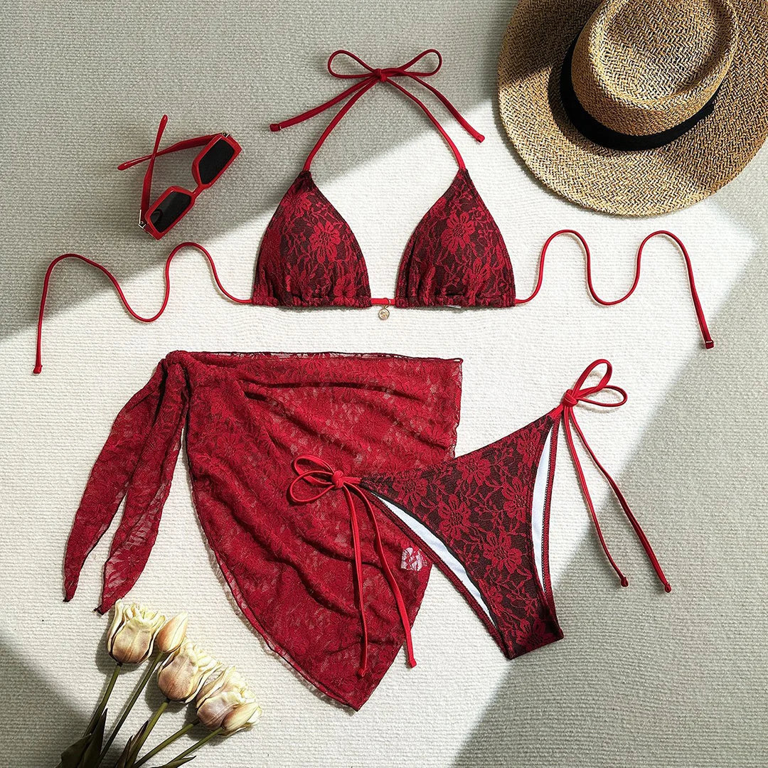 Three-piece bikini set featuring a lace halter top, high cut bikini bottoms, and mesh sarong in solid colors for an elegant and alluring beach look.