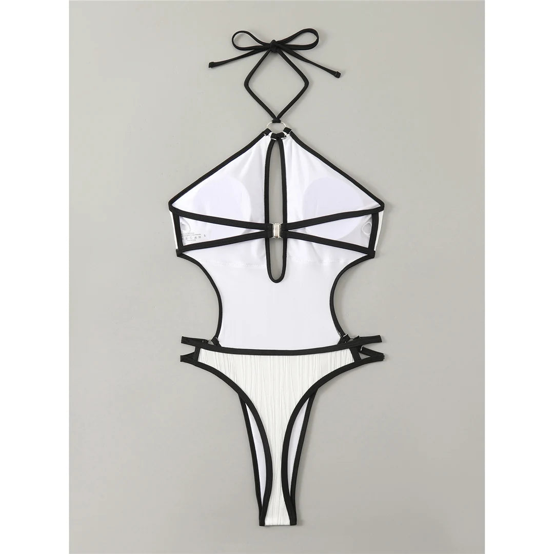 Wrinkled cut out halter monokini in white, featuring a patchwork design with triangle top and adjustable straps, made from polyester and spandex.