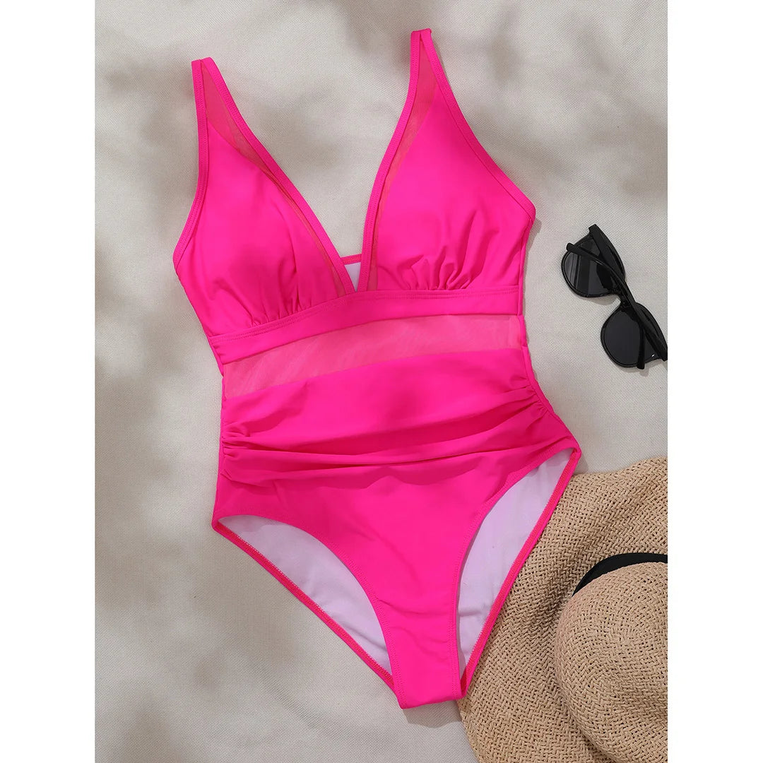 Mesh Sheer V Neck Leopard Printed One Piece Swimsuit erhältlich in den Größen S bis XL. Dieser einteilige Badeanzug oder Monokini aus Nylon und Elasthan ist mit durchsichtigen Mesh-Details und einem auffälligen Leopardenprint versehen. Mit seinem tiefen V-Ausschnitt und der schmeichelhaften Silhouette ist er perfekt, um am Pool oder am Strand einen auffälligen Eindruck zu hinterlassen. Erhältlich in Schwarz, Tiefblau, Pink, Rot, Weiß, Dunkelgrün, Grün, Blätter, Leopard und Multicolor.