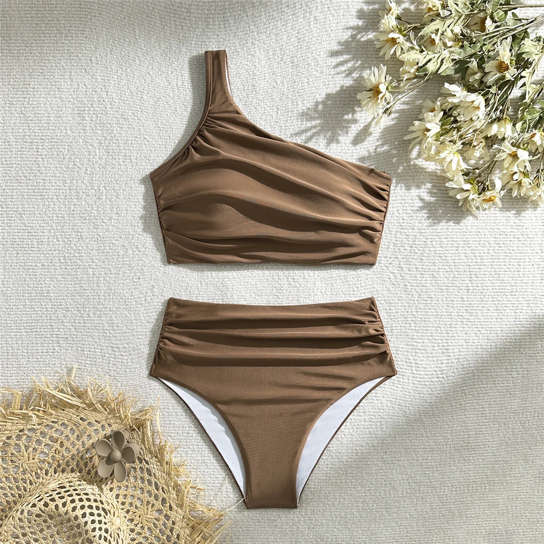 Wrinkled one-shoulder high waist bikini set, distinctive design, polyester spandex blend, wire-free support, women's solid two-piece swimwear, modern elegance and comfort.