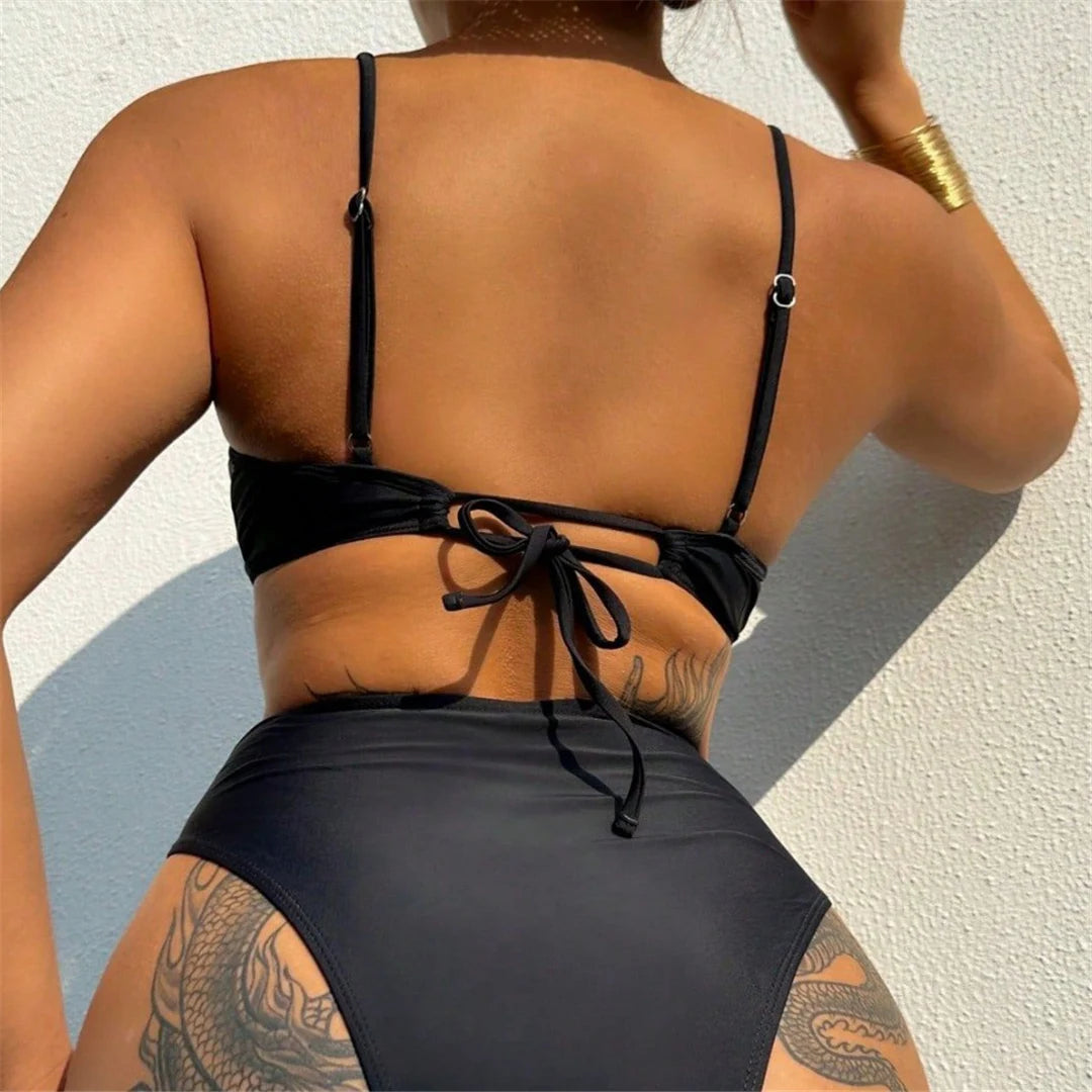 Sophisticated Two-Piece Swimsuit for Women, Features Bold Cut-Out Design and High-Waist Bikini Bottoms, High-Leg Cut, Fits True to Size, Available in Sizes S to XL, Material: Nylon and Spandex, Solid Pattern, Wire Free, Ideal for a Blend of Contemporary Fashion and Classic Comfort, Black Color, Comes with Padding