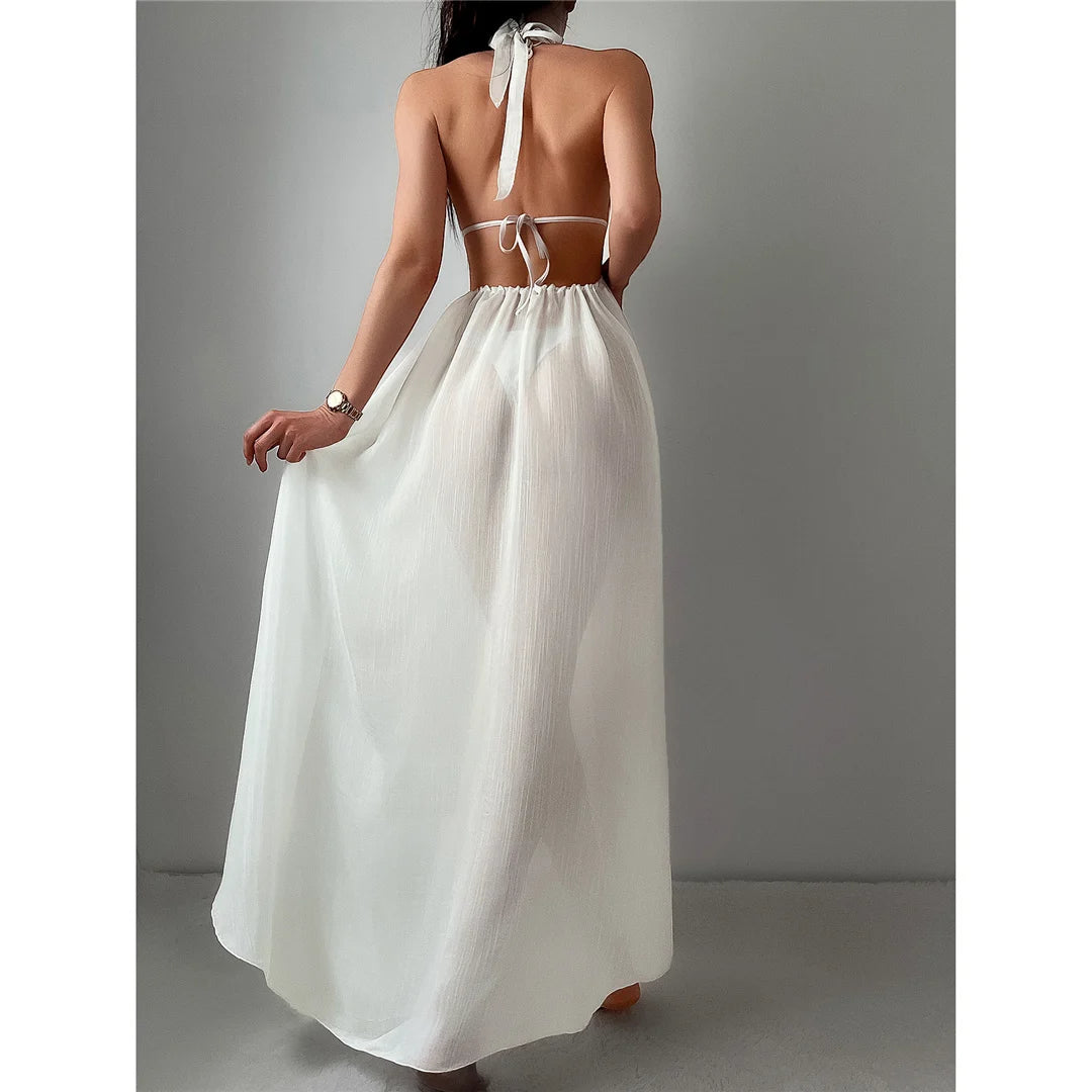 Halter Deep V-Neck Tunic Beach Cover-Up with a Gorgeous Backless Design. Available in Solid White color. Made of Nylon, Polyester, Rayon, and Cotton. Fits True to Size, Sizing Options include S to XL. Suitable for Female age group 18-35, adult. Currently in Stock with Free Shipping