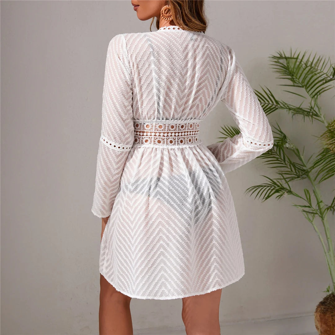 Wave long sleeve hollow out crochet tunic in solid white, featuring intricate detailing, made from polyester.