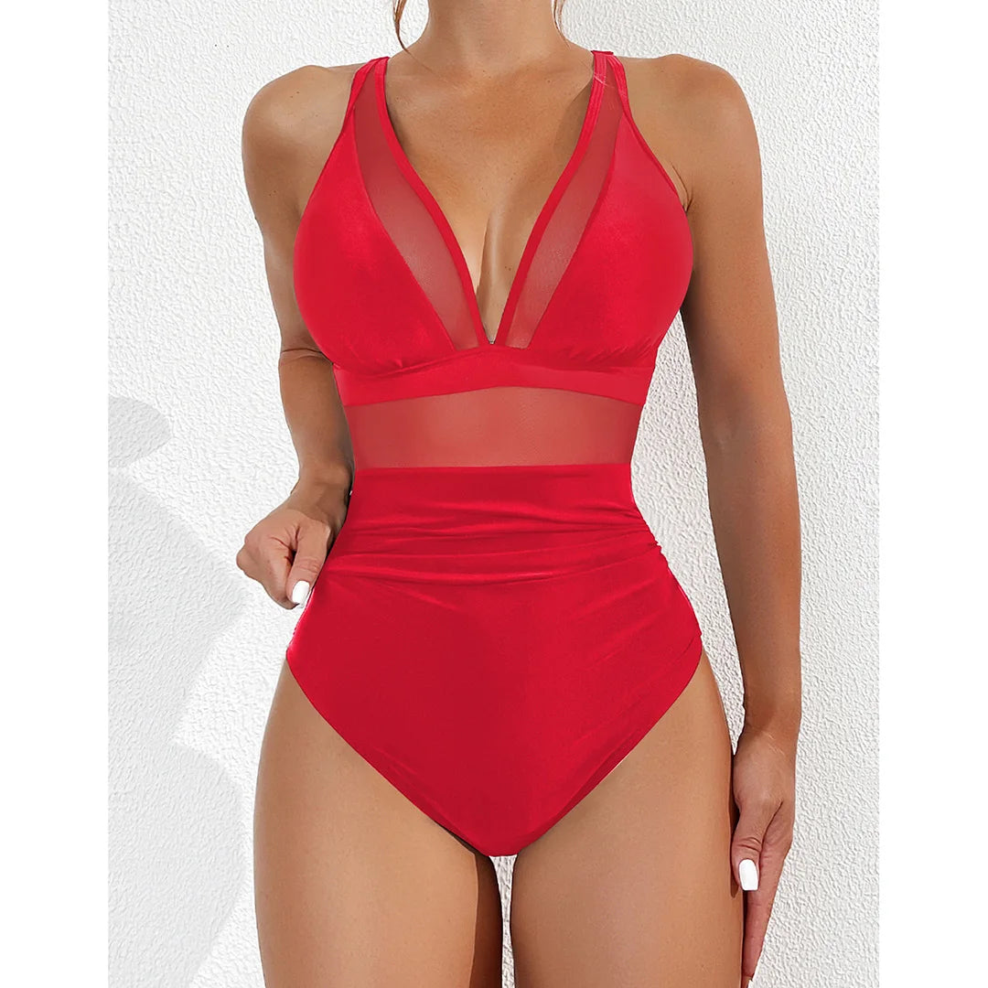 Mesh Sheer V Neck Leopard Printed One Piece Swimsuit available in sizes S to XL. Made of Nylon and Spandex, this one-piece swimsuit or monokini features sheer mesh detailing and a bold leopard print. With its deep V neck and flattering silhouette, it is perfect for making a striking impression at the pool or beach. Available in Black, Deep Blue, Hot Pink, Red, White, Dark Green, Green, Leaves, Leopard, and Multicolor.