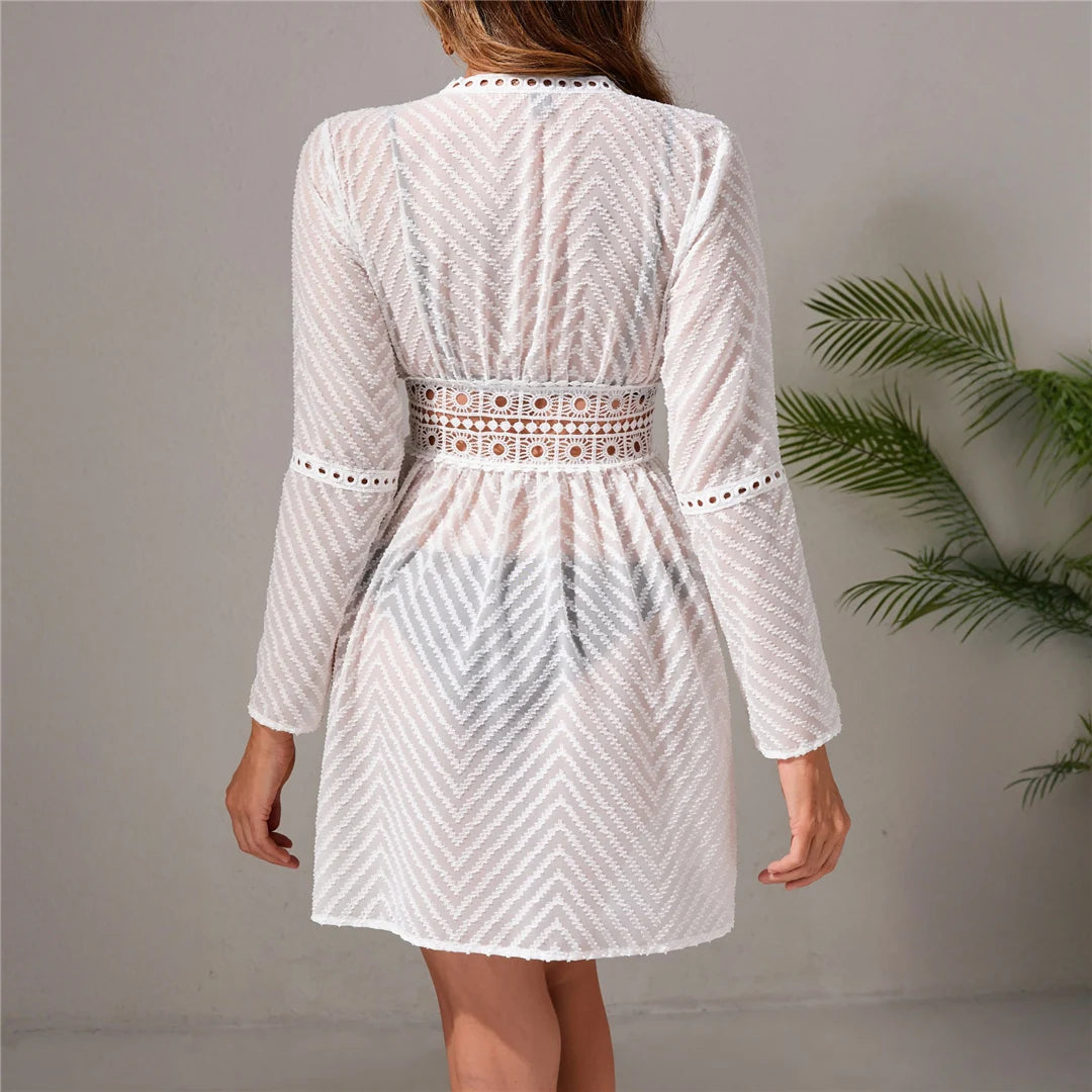 Wave long sleeve hollow out crochet tunic in solid white, featuring intricate detailing, made from polyester.