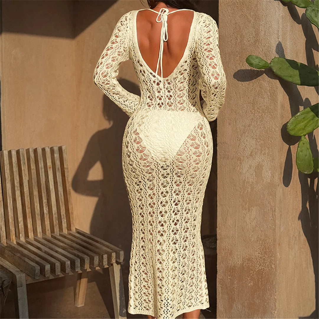 Long sleeve backless knitted tunic beach cover-up with hollow-out design for women.