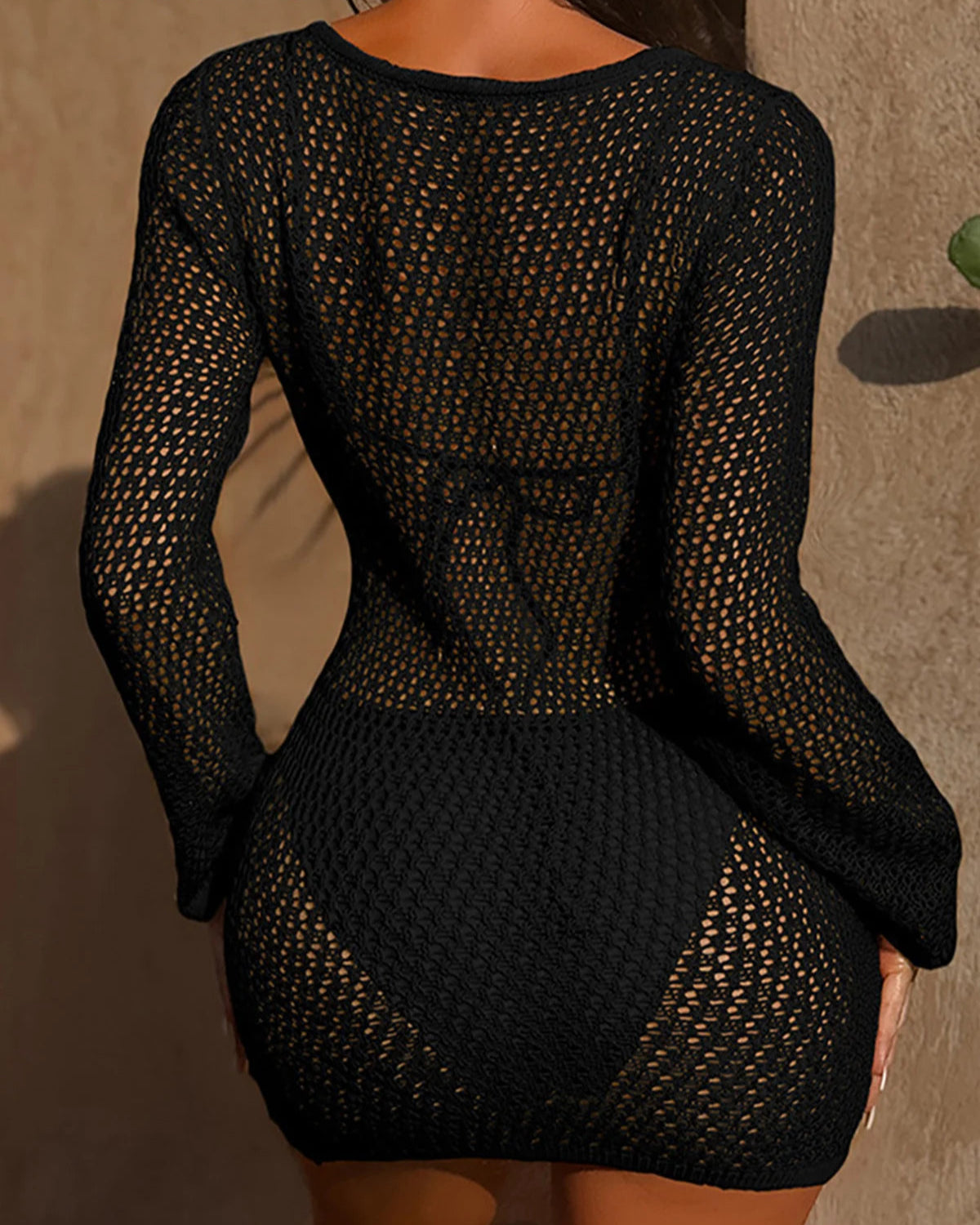 Long sleeve hollow-out crochet tunic beach cover-up with intricate knitted design for women.