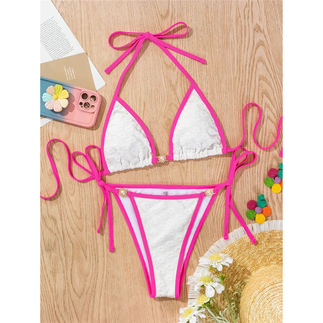 Pearl rhinestones halter high cut bikini in solid white for a glamorous and sophisticated beach style.