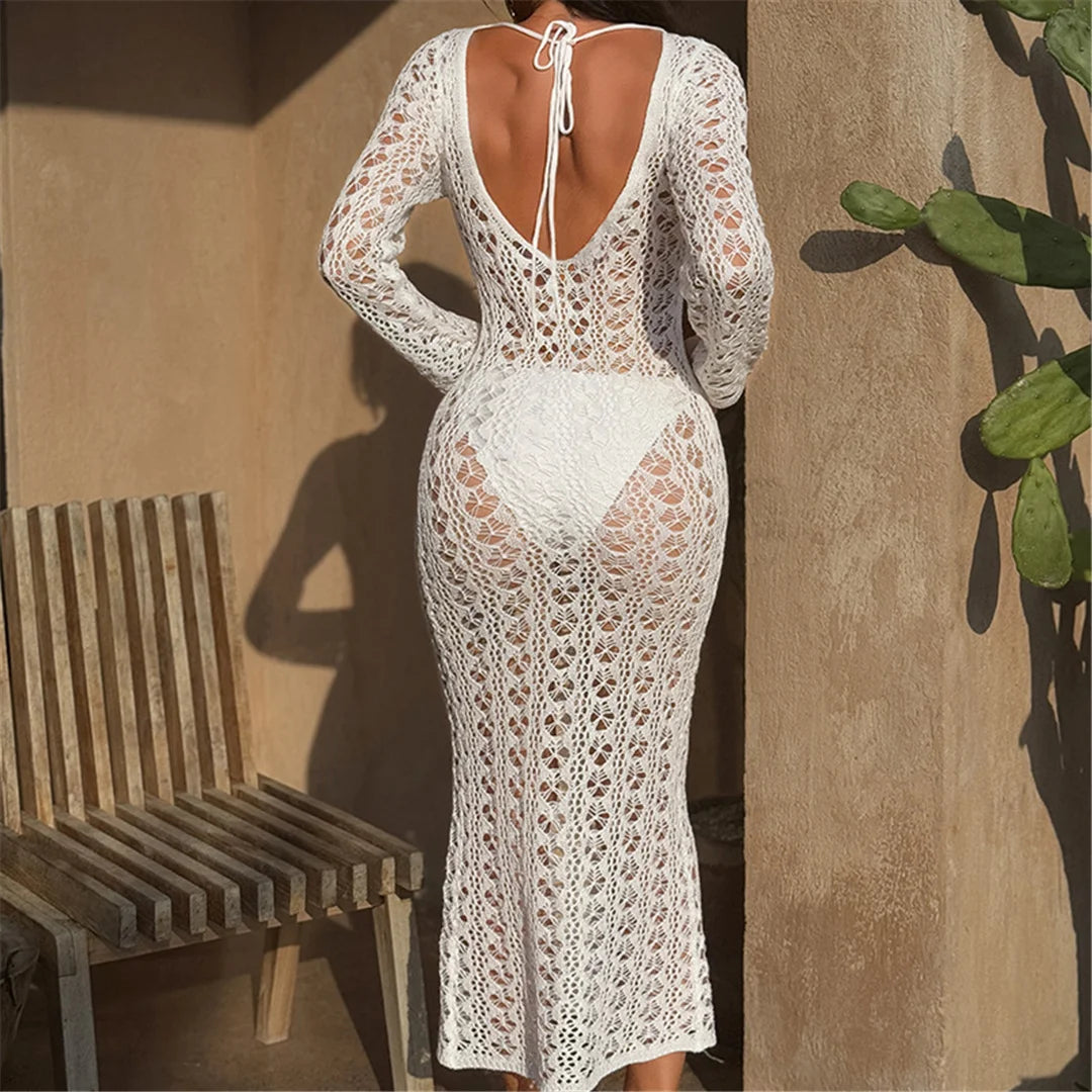 Long sleeve backless knitted tunic beach cover-up with hollow-out design for women.