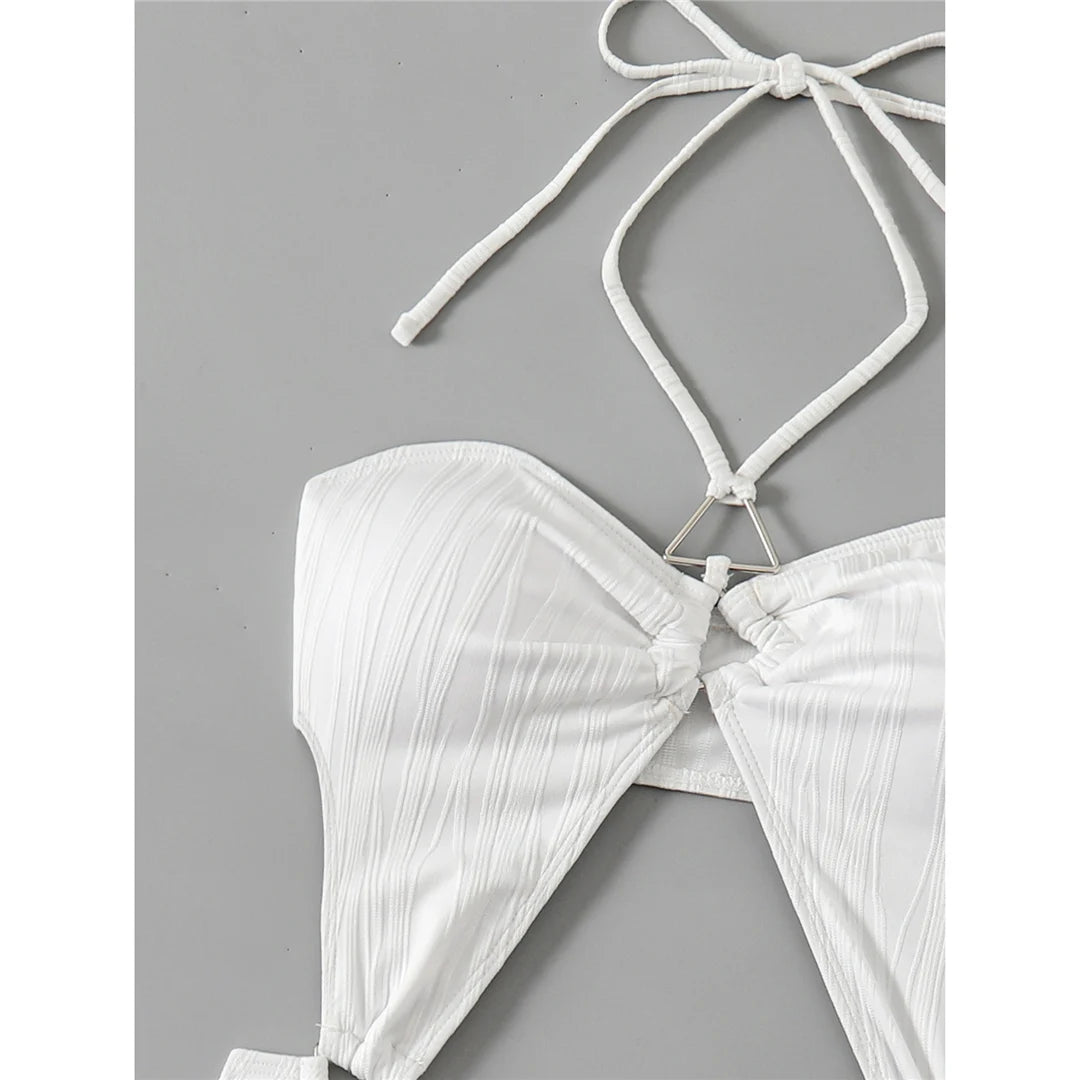 Tummy cut-out halter swimsuit in white, offering a sophisticated and modern fit in one piece design.