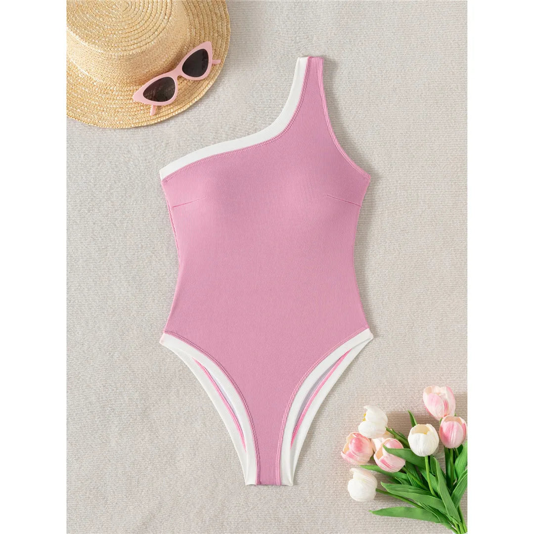 One-shoulder ribbed high-cut leg one-piece swimsuit with splicing design and padded support for women.
