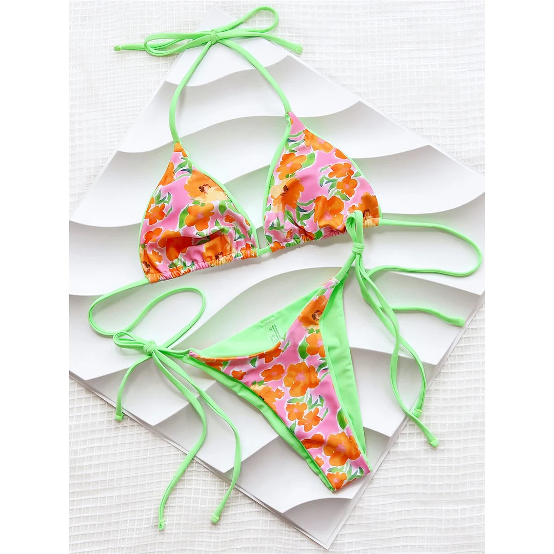 Flowers Printed Halter Strappy Bikini Set, Two-Piece Floral Swimwear, Made of Nylon and Spandex, Floral Print, Wire-Free Support, Low Waist Design, True to Size, Women's Bikini Set, Comes with Padding, Available in Sizes Small, Medium, Large, In Orange Color, Free Shipping.