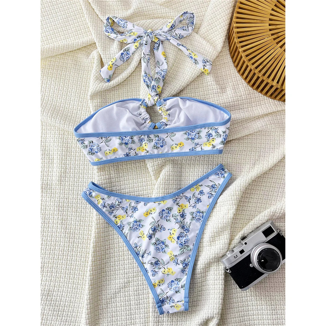Floral flower printed Brazilian bikini set with vibrant print and low waist design for a fun and stylish beach look.