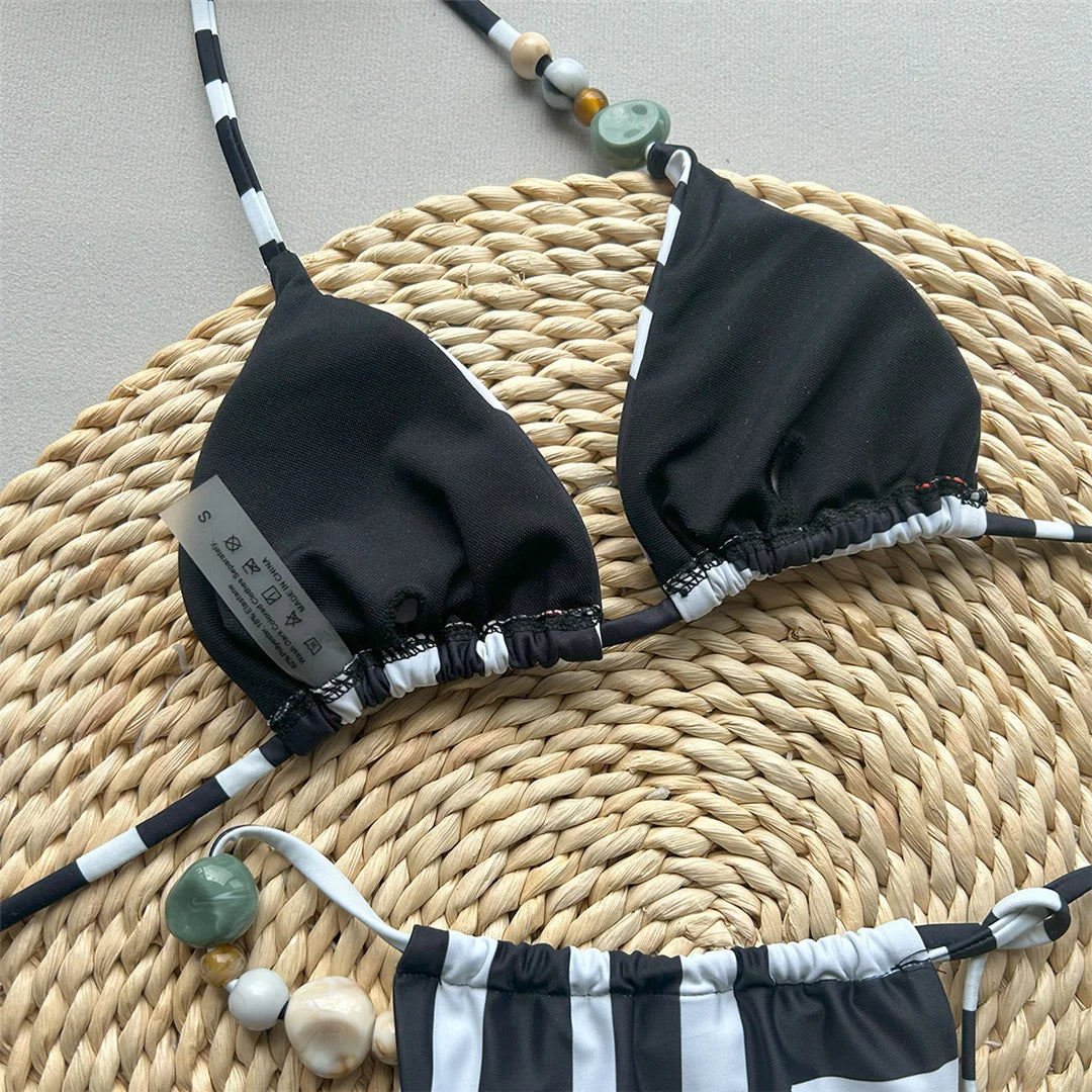 Halter striped high leg bikini set with padded design for a chic and nautical look for women.