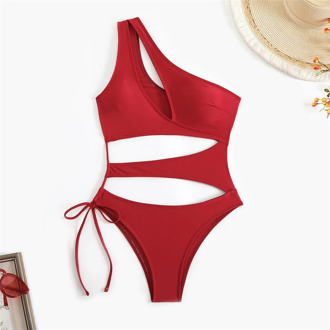 Cut out asymmetric one shoulder one piece swimsuit in red, black, and coffee with high leg design.