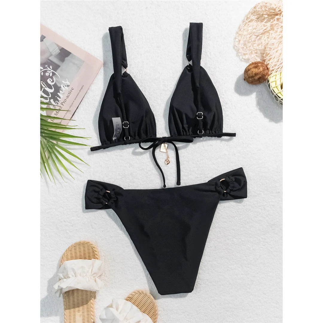 High-leg cut bikini set with stylish metal ring details and padded design for a chic and modern swimwear look for women.