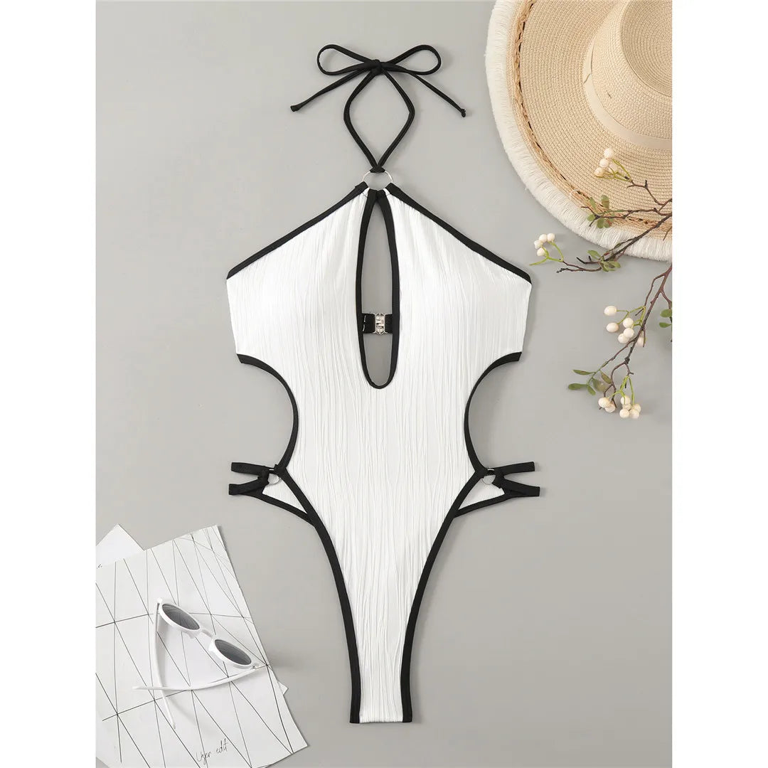Wrinkled cut out halter monokini in white, featuring a patchwork design with triangle top and adjustable straps, made from polyester and spandex.