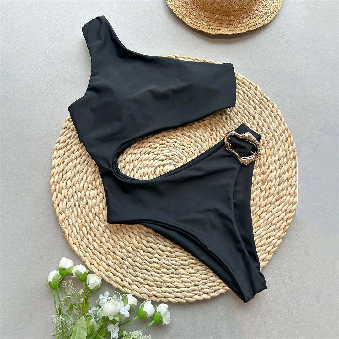 Asymmetric Metal Ring Swimsuit with stylish ring embellishments, monochrome solid color, polyester and spandex blend, adjustable shoulder straps, perfect for modern beach fashion.