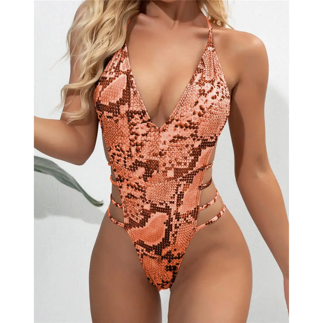 Snake Skin Monokini, High Cut One-Piece Swimsuit with Deep V Neckline, Made of Nylon and Spandex, Vibrant Snake Print, Wire-Free Support, True to Size, Women's Swimwear, Comes with Padding, Available in Sizes Small, Medium, and Large, Colors Available: Green, Blue, Snake Print, Orange, Multicolor, Free Shipping.