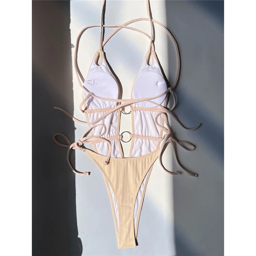 Deep V-neck halter one-piece swimsuit, high-leg mini thong design, adjustable triangle top, monochrome solid pattern, polyester spandex blend, women's bold and elegant swimwear.