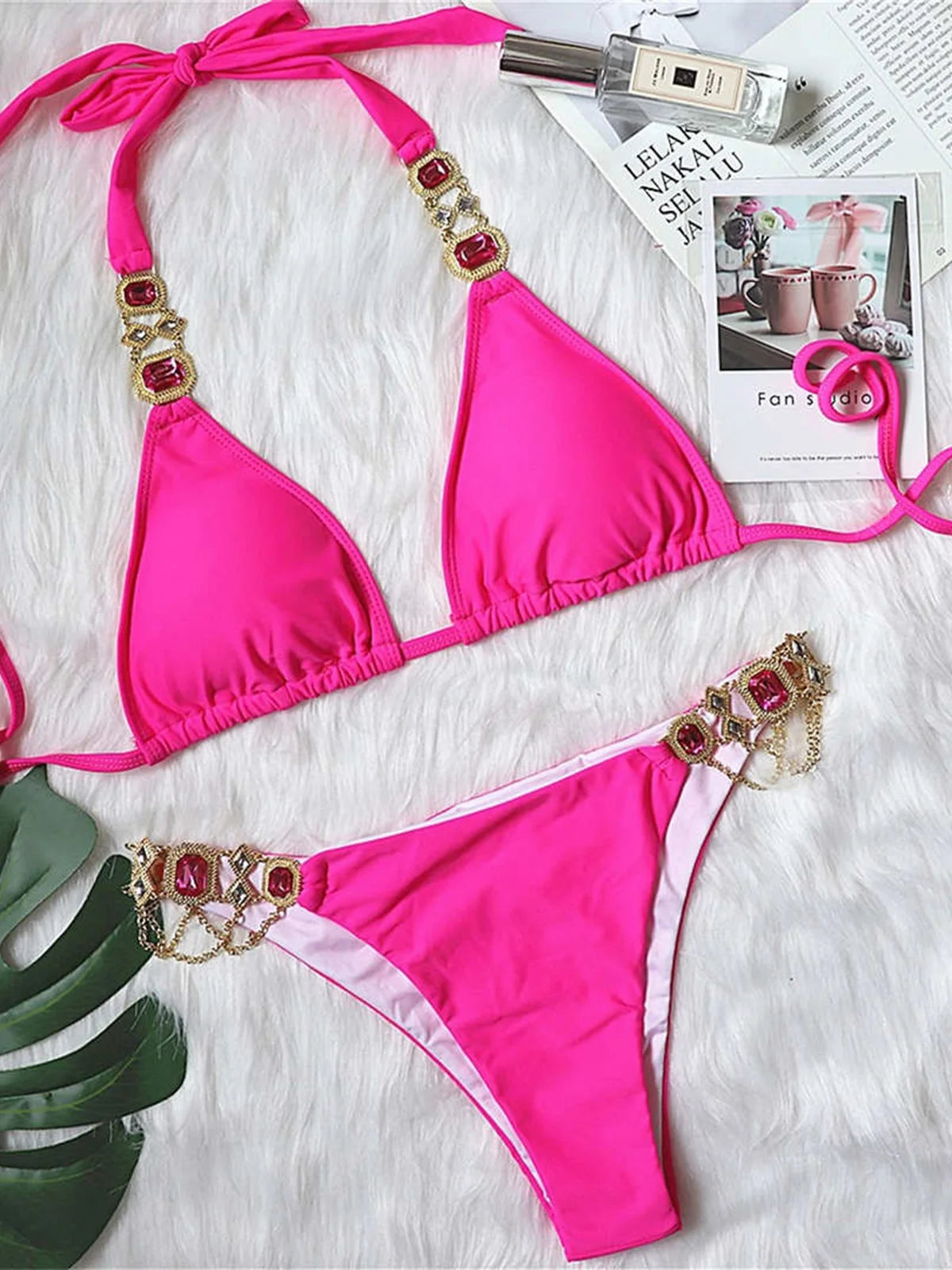 Opulent jewelled rhinestones luxury diamond bikini set available in Yellow, Red, Hot Pink, White, Silver, Purple, Sky Blue, and Black. A shimmering two-piece swimsuit made from nylon and spandex, featuring wire-free support and low waist design. Fits true to size, perfect for women who seek glamour and luxury in their swimwear.