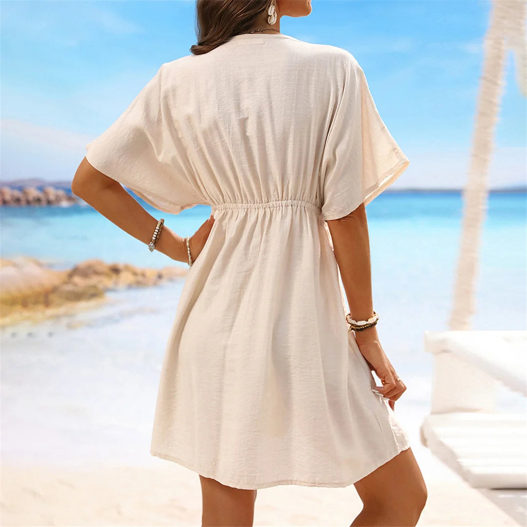 Lace Short Sleeve Tunic with a flattering V-neckline, a perfect beach cover-up available in sizes S to XL. Made of Nylon, Polyester, and Cotton, this Tunic is available in Black, Dark Blue, Green, Hot Pink, Peach Red, Peach, Red, Multicolor, Sky Blue, White, and Beige. Its lightweight fabric and intricate lace details provide a breathable, relaxed fit, perfect for sunny days and transitions seamlessly from the beach to casual outings.