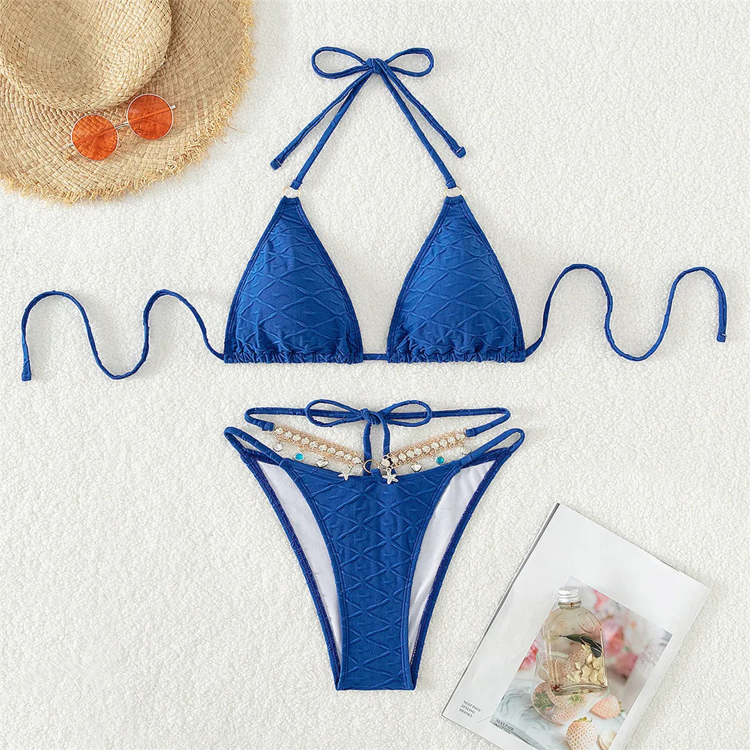 Dazzling Two-Piece Halter Bikini Set for Women, Adorned with Diamond Rhinestones and Unique Wrinkled Design. Solid Color Swimwear Made of Nylon and Spandex. Features Low Waist and Wire-Free Support. True to Size Fit with Padding. Perfect for a Glamorous Beachside Experience. Color: Blue.