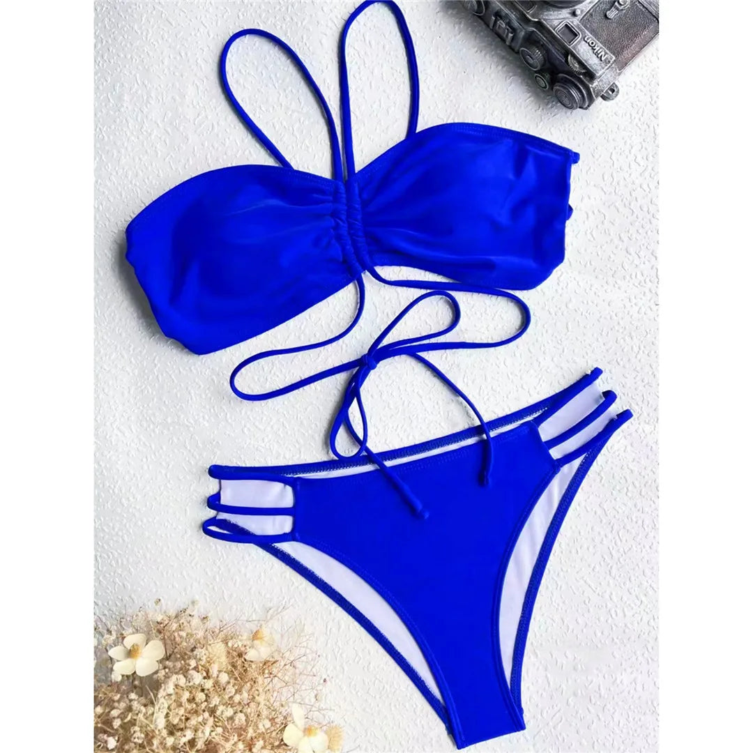 Turn-Heads Strappy High-Leg Cut Bikini Set in Royal Blue, Crafted from Nylon and Spandex. Designed with a Wire Free and Low Waist Design. Fits True to Size for Middle Aged Women. Two-Piece Set Featuring Padded Top for Comfort and Support. New and in Stock.