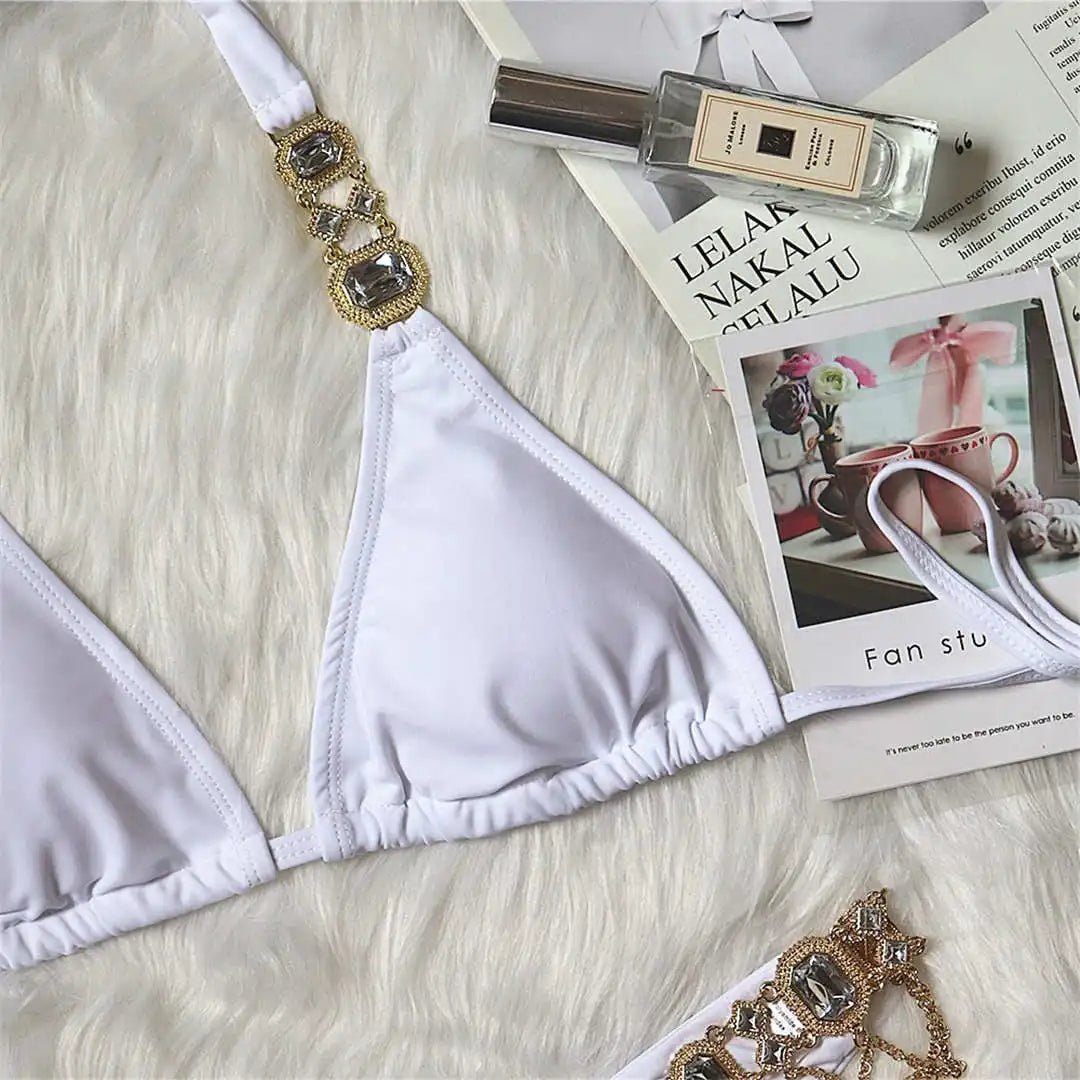 Opulent jewelled rhinestones luxury diamond bikini set available in Yellow, Red, Hot Pink, White, Silver, Purple, Sky Blue, and Black. A shimmering two-piece swimsuit made from nylon and spandex, featuring wire-free support and low waist design. Fits true to size, perfect for women who seek glamour and luxury in their swimwear.