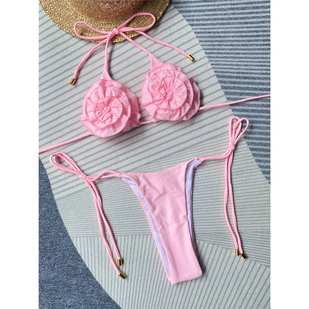 Women's Flowers Halter Mini Thong Bikini Set in Solid Colors. Made from Nylon and Spandex, Fits True to Size with Wire Free Support. Features a Flirtatious Floral Pattern and Low Waist Design. Available in Sizes S, M, L and in Colors Pink White, Pink, White, and Multicolor. Perfect for making a Statement by the Water.