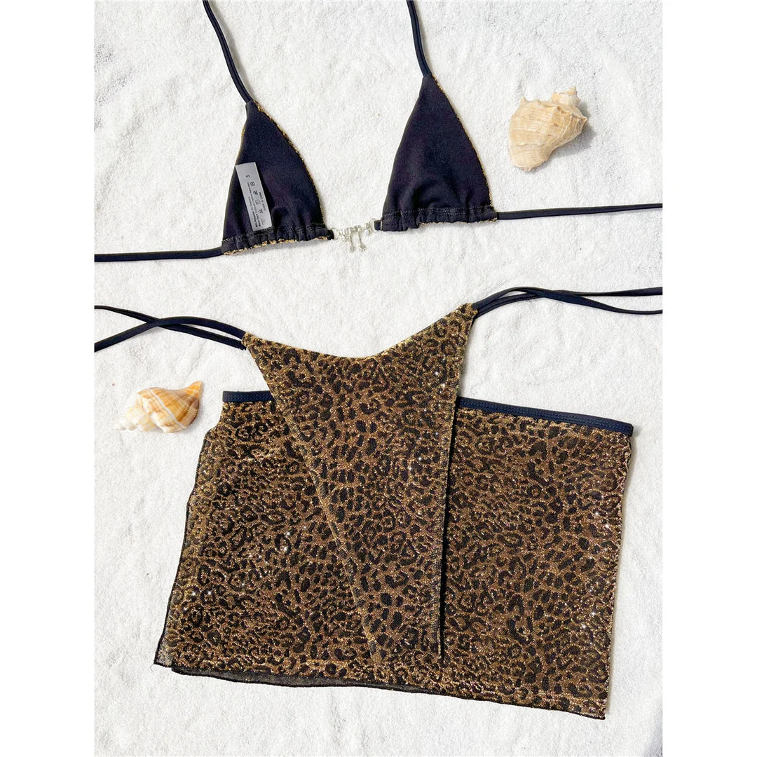 Leopard halter bikini set with striking leopard print in gold, featuring a high cut and matching skirt.