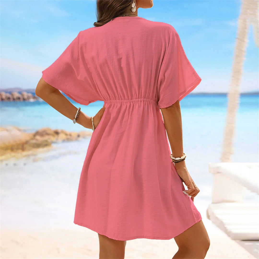 Lace Short Sleeve Tunic with a flattering V-neckline, a perfect beach cover-up available in sizes S to XL. Made of Nylon, Polyester, and Cotton, this Tunic is available in Black, Dark Blue, Green, Hot Pink, Peach Red, Peach, Red, Multicolor, Sky Blue, White, and Beige. Its lightweight fabric and intricate lace details provide a breathable, relaxed fit, perfect for sunny days and transitions seamlessly from the beach to casual outings.
