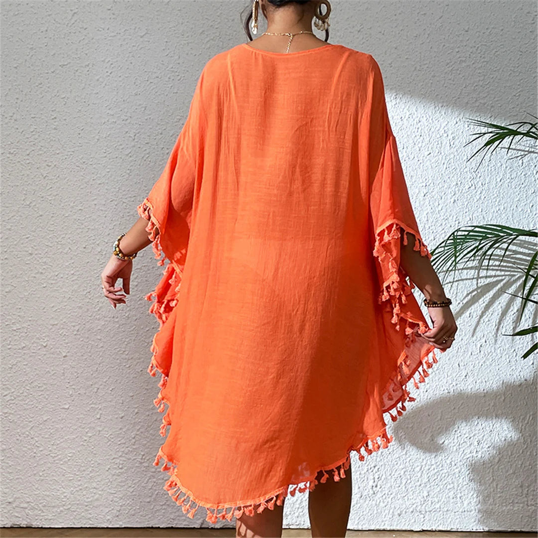 Fringe Tassel Embroidery Beach Cover-Up for women. Bohemian style tunic featuring half sleeves and long beach dress design. Made of nylon, polyester, rayon, and cotton. Fits true to size in sizes S, M, L, perfect for adults aged 18-35. This product is in stock with free shipping and available in orange, white, and black colors.