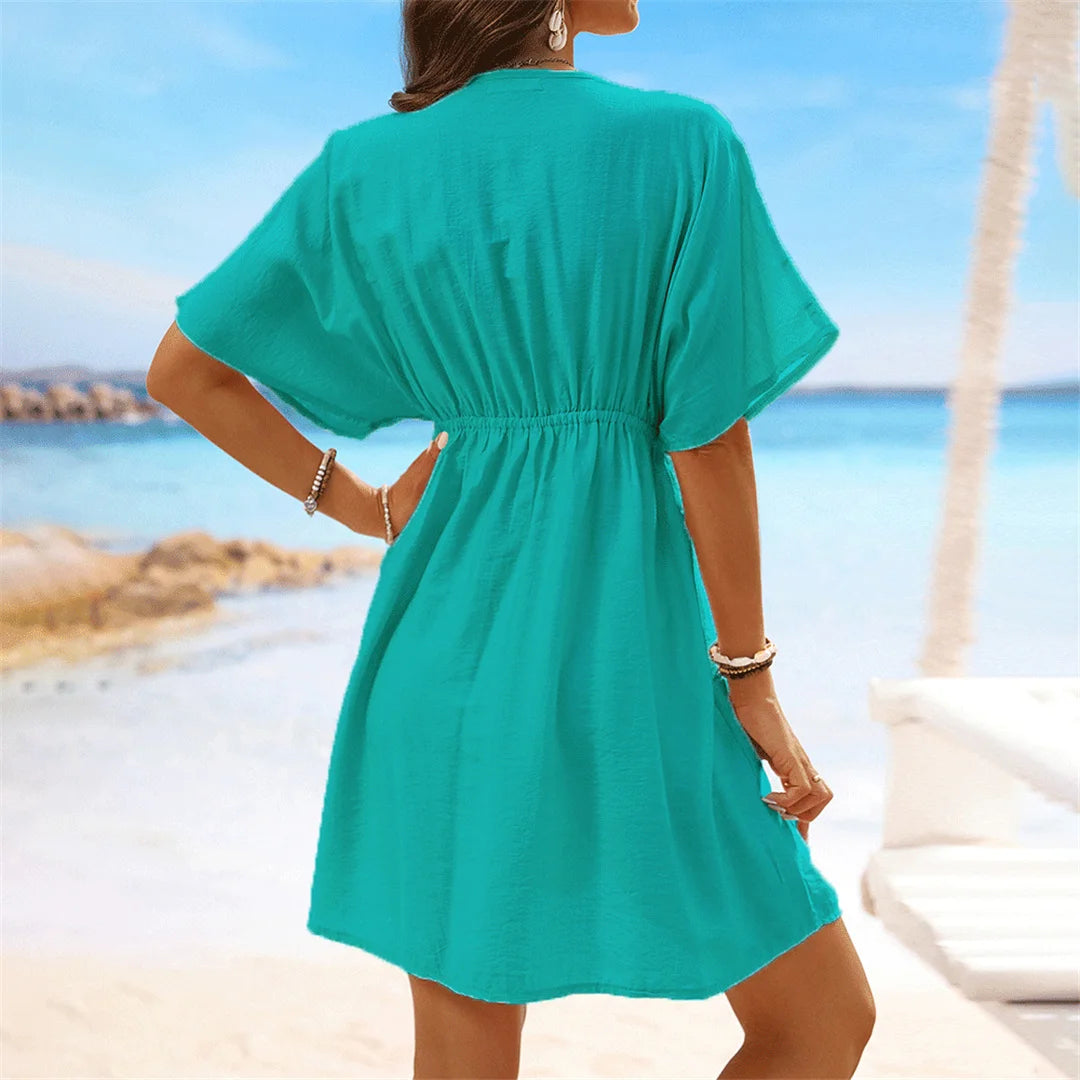 Lace Short Sleeve Tunic with a flattering V-neckline, a perfect beach cover-up available in sizes S to XL. Made of Nylon, Polyester, and Cotton, this Tunic is available in Black, Dark Blue, Green, Hot Pink, Peach Red, Peach, Red, Multicolor, Sky Blue, White, and Beige. Its lightweight fabric and intricate lace details provide a breathable, relaxed fit, perfect for sunny days and transitions seamlessly from the beach to casual outings.