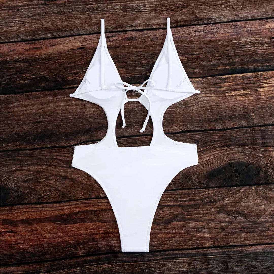 Tummy Cut-Out Backless One Piece Swimsuit with a High Cut Monokini Design. Available in Solid Black and White colors. Made of Nylon and Spandex, Padding included. Fits True to Size, Sizing Options available from S to XL. Suitable for Female age group 18-35, adult. Currently in Stock with Free Shipping.