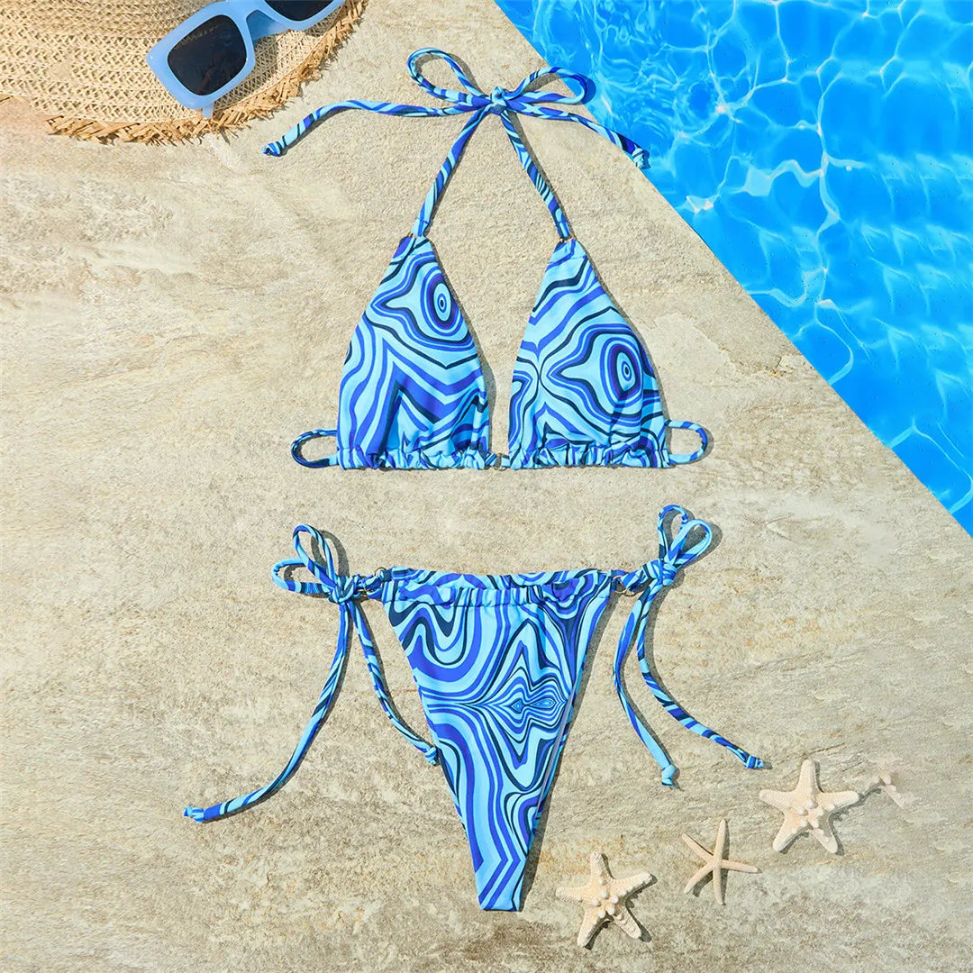 Stunning Four-Color Strappy Halter Bikini Set with Eye-Catching Print, Crafted from Nylon and Spandex. Features Wire Free Support, Low Waist Design in Blue and Multicolor. Ideal for Middle Aged Women. Fits True to Size and Comes with Padding for Extra Comfort. Brand New and in Stock.