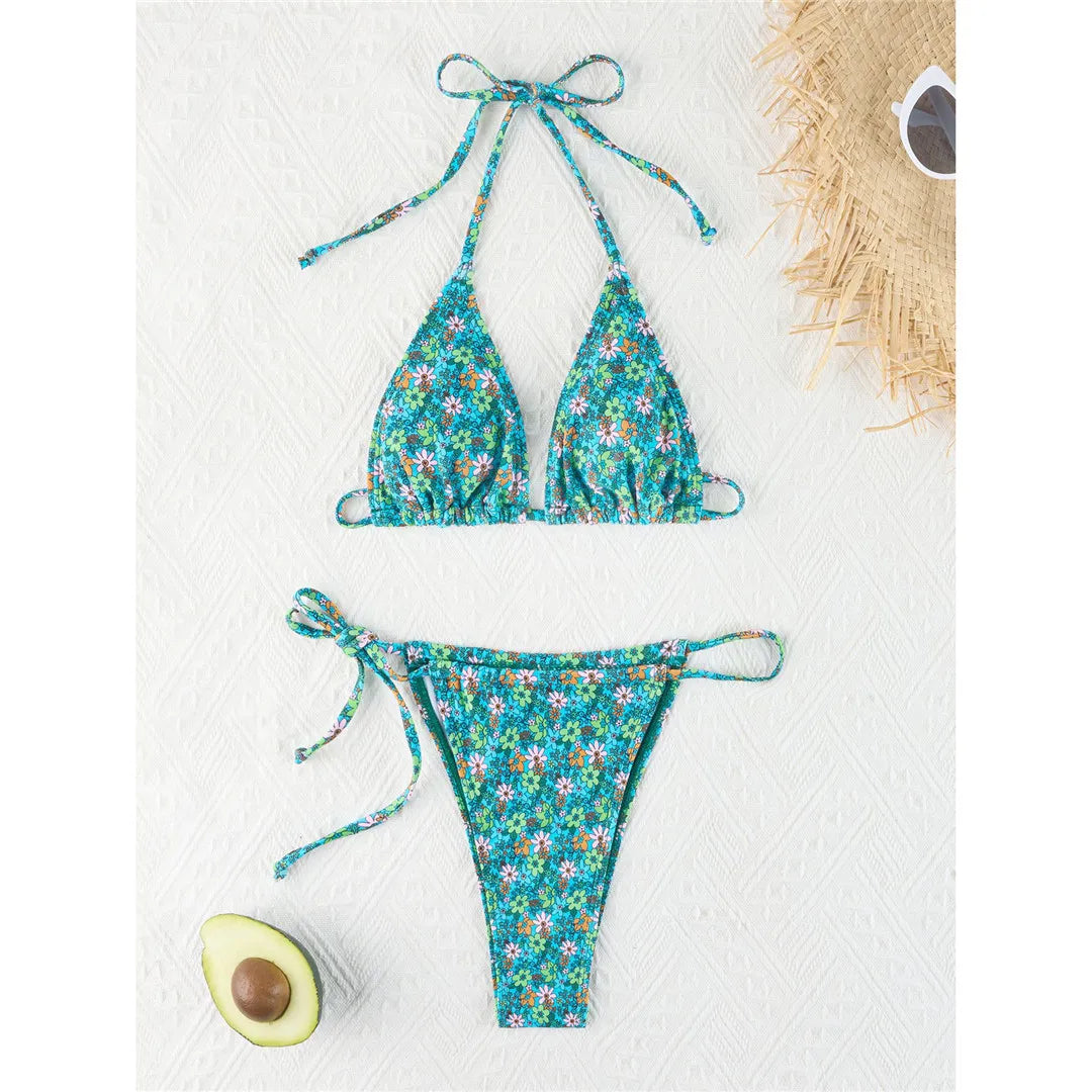Vibrant Four-Color Halter Bikini Set with Captivating Flower Print, Made from Nylon and Spandex. Features High-Leg Cut, Wire Free Support and Low Waist Style in Green, Blue and Yellow Colors. Fits True to Size, Ideal for Middle Aged Women. Comes with Padding for Extra Comfort. Brand New and Available in Stock.